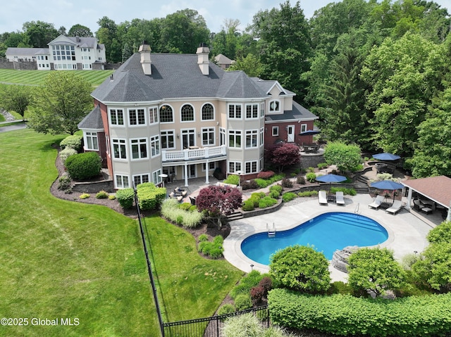1 Stoneridge Dr, Colonie, NY 12211 - rear view of property with a patio area, a lawn, a chimney, and an outdoor pool