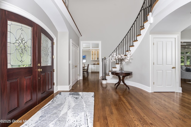 1 Stoneridge Dr, Colonie, NY 12211 - entrance foyer featuring stairway, arched walkways, and dark wood-type flooring
