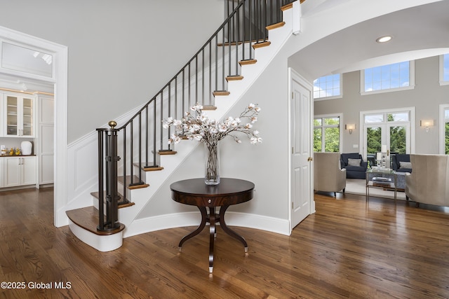 1 Stoneridge Dr, Colonie, NY 12211 - staircase with wood finished floors, a high ceiling, arched walkways, and recessed lighting