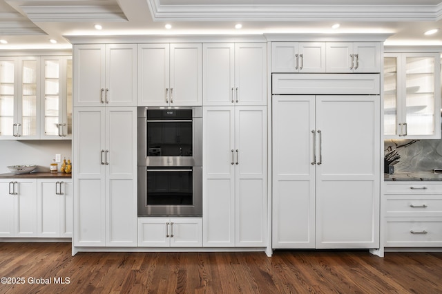 1 Stoneridge Dr, Colonie, NY 12211 - kitchen with double oven, crown molding, dark wood-style floors, white cabinetry, and glass insert cabinets