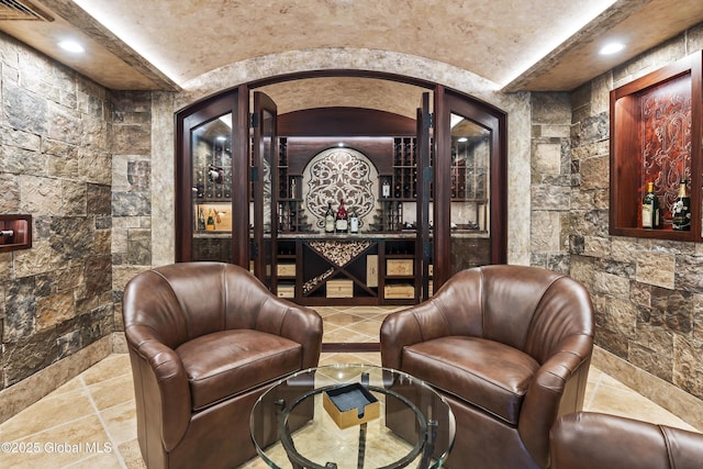 1 Stoneridge Dr, Colonie, NY 12211 - wine area with recessed lighting and stone tile floors