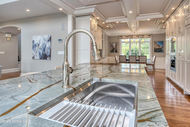 1 Stoneridge Dr, Colonie, NY 12211 - kitchen with ornamental molding, arched walkways, recessed lighting, a decorative wall, and coffered ceiling