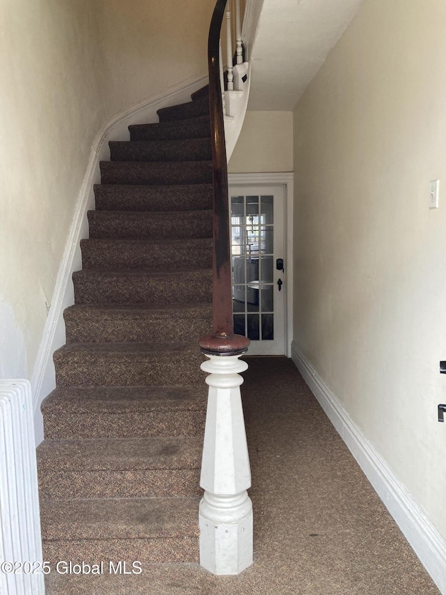 45 14th St, Troy, NY 12180 - stairway featuring radiator, carpet, and baseboards