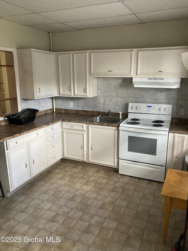 45 14th St, Troy, NY 12180 - kitchen with white range with electric cooktop, under cabinet range hood, a sink, a drop ceiling, and dark countertops