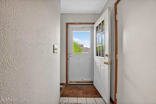 35 Justine Ct, East Greenbush, NY 12144 - doorway to outside with a textured wall