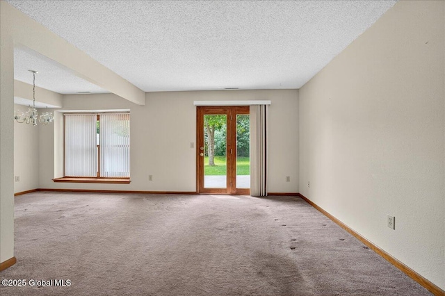 35 Justine Ct, East Greenbush, NY 12144 - carpeted empty room with plenty of natural light, a chandelier, and a textured ceiling