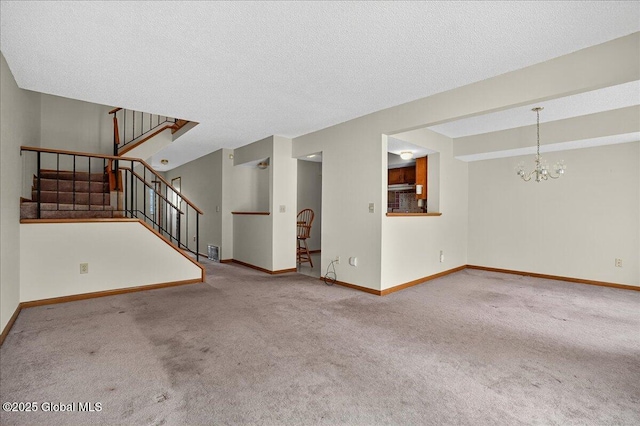 35 Justine Ct, East Greenbush, NY 12144 - unfurnished living room featuring carpet flooring, a chandelier, stairway, and a textured ceiling