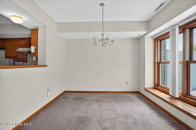 35 Justine Ct, East Greenbush, NY 12144 - carpeted spare room featuring a textured ceiling and a chandelier