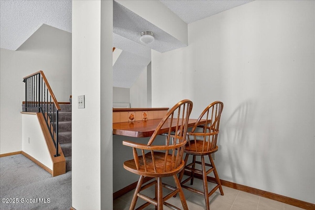 35 Justine Ct, East Greenbush, NY 12144 - dining area with a textured ceiling and stairs