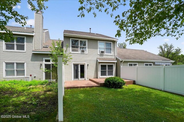 35 Justine Ct, East Greenbush, NY 12144 - rear view of property with a chimney and a wooden deck