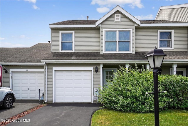 35 Justine Ct, East Greenbush, NY 12144 - view of front facade featuring roof with shingles and asphalt driveway