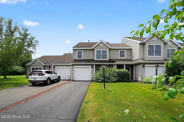 35 Justine Ct, East Greenbush, NY 12144 - view of front of home with driveway, a front lawn, and an attached garage