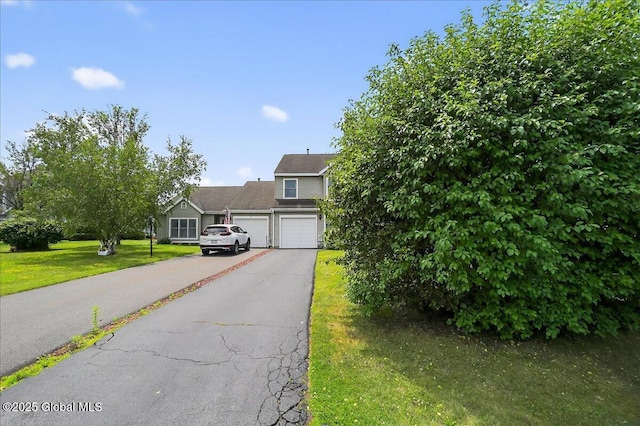 35 Justine Ct, East Greenbush, NY 12144 - view of front facade with asphalt driveway, a front lawn, and a garage
