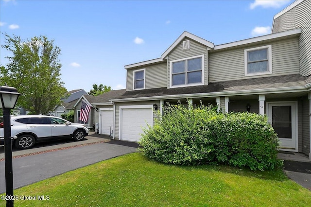 35 Justine Ct, East Greenbush, NY 12144 - traditional home featuring asphalt driveway, a front yard, and a garage