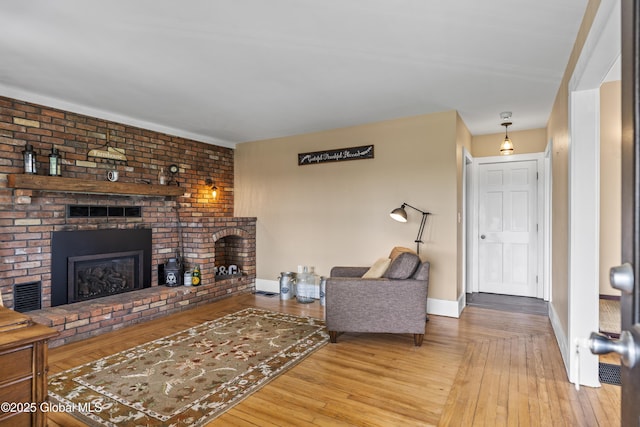 363 Goodman Rd, Fort Ann, NY 12827 - living area featuring a fireplace, hardwood / wood-style flooring, and baseboards