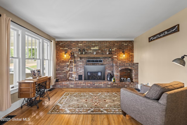 363 Goodman Rd, Fort Ann, NY 12827 - living area with hardwood / wood-style flooring and a brick fireplace