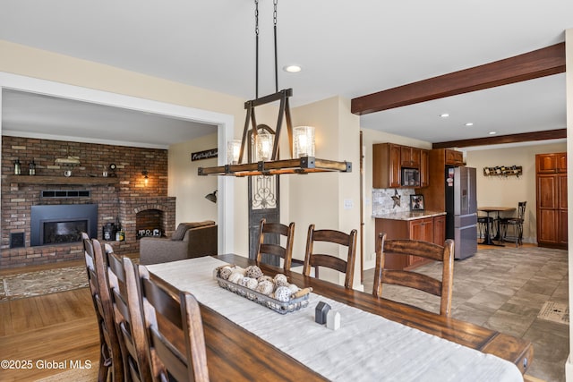 363 Goodman Rd, Fort Ann, NY 12827 - dining area with a brick fireplace, recessed lighting, beamed ceiling, and baseboards