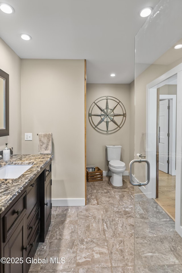 363 Goodman Rd, Fort Ann, NY 12827 - bathroom with baseboards, vanity, recessed lighting, and toilet