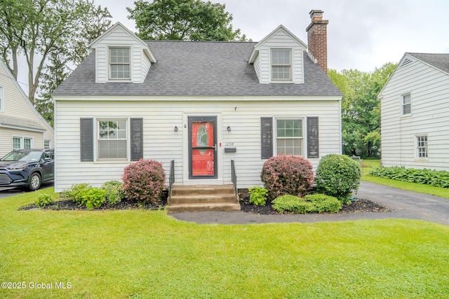1298 Mcclellan St, Schenectady, NY 12309 - cape cod-style house with a front lawn, a shingled roof, and a chimney