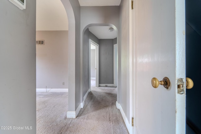 1298 Mcclellan St, Schenectady, NY 12309 - hallway with light carpet and arched walkways
