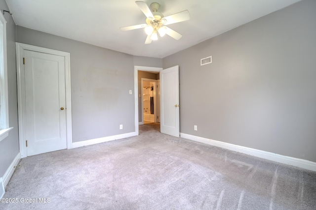 1298 Mcclellan St, Schenectady, NY 12309 - unfurnished bedroom featuring light carpet and a ceiling fan