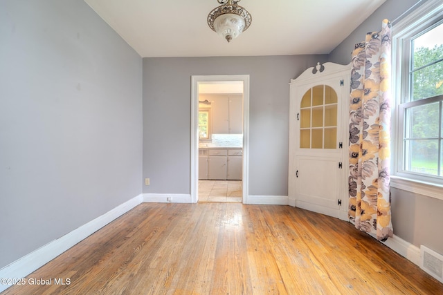 1298 Mcclellan St, Schenectady, NY 12309 - spare room with light wood-type flooring and baseboards