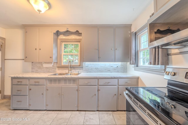 1298 Mcclellan St, Schenectady, NY 12309 - kitchen featuring appliances with stainless steel finishes, tasteful backsplash, and healthy amount of natural light