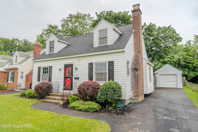 1298 Mcclellan St, Schenectady, NY 12309 - new england style home with an outdoor structure, roof with shingles, a chimney, and asphalt driveway