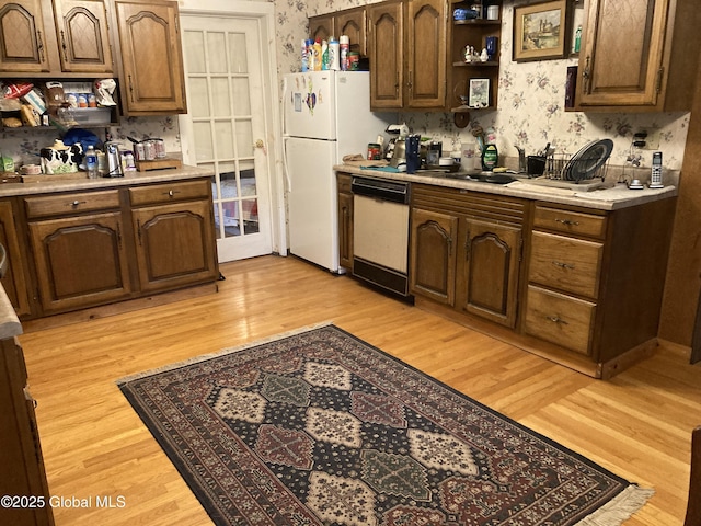 48 Spring St, Port Henry, NY 12974 - kitchen featuring white appliances, wallpapered walls, light countertops, light wood-type flooring, and open shelves