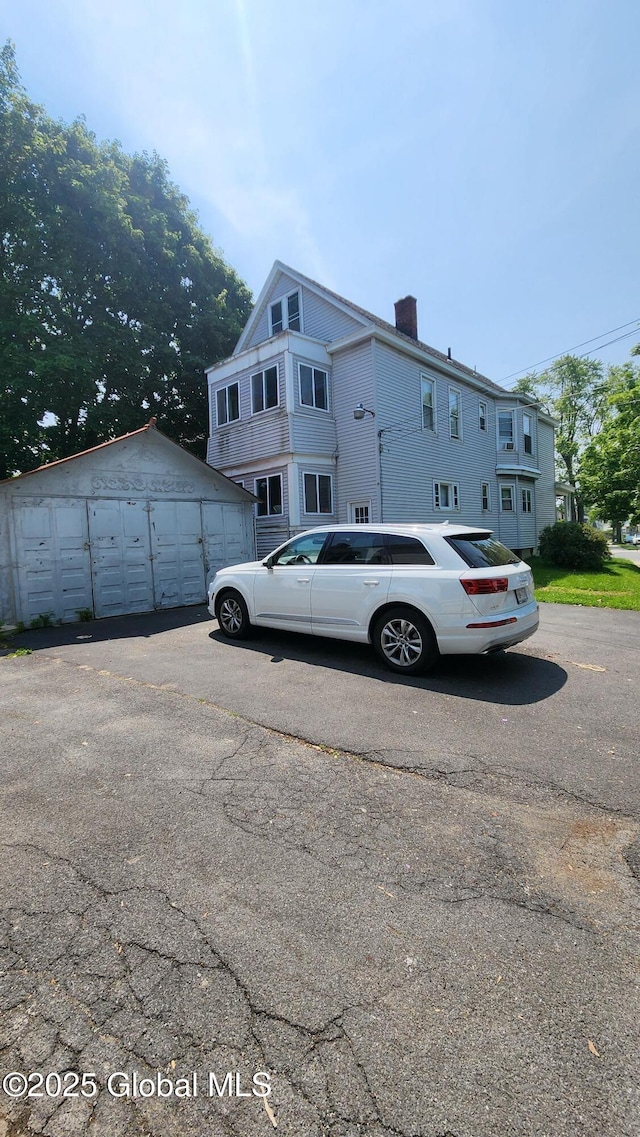 359 2nd Ave, Albany, NY 12209 - view of front of property with a chimney and an outdoor structure