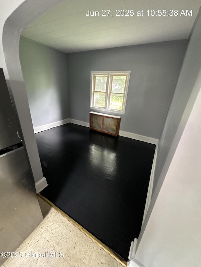 359 2nd Ave, Albany, NY 12209 - unfurnished room featuring radiator heating unit and arched walkways