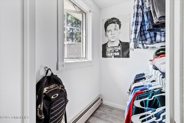 17 Cypress Pt, Clifton Park, NY 12065 - walk in closet featuring a baseboard heating unit and light wood-style floors
