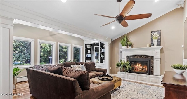 17 Cypress Pt, Clifton Park, NY 12065 - living room with crown molding, a baseboard heating unit, a fireplace, ceiling fan, and ornate columns