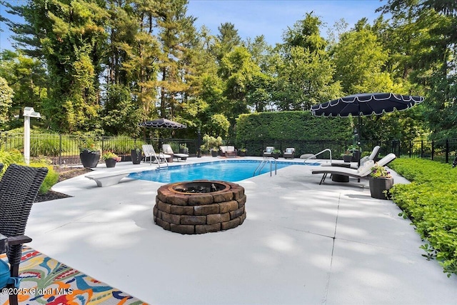 17 Cypress Pt, Clifton Park, NY 12065 - view of pool featuring a fire pit, a patio, a fenced backyard, and view of wooded area