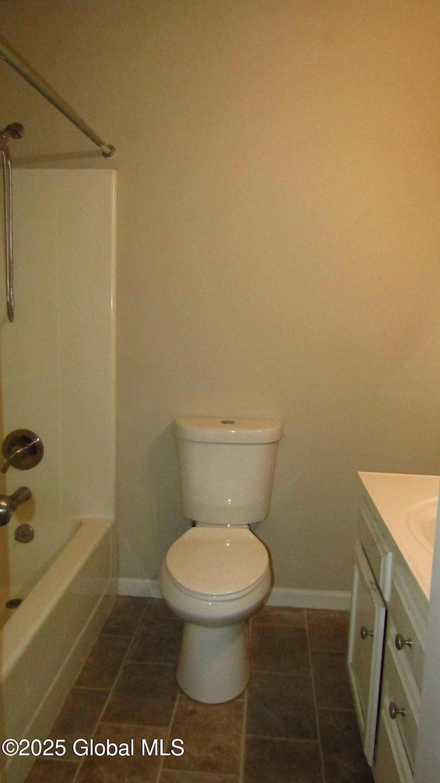 8 Cloverleaf Dr, Warrensburg, NY 12885 - bathroom featuring vanity, baseboards, toilet, tile patterned flooring, and shower / bathtub combination