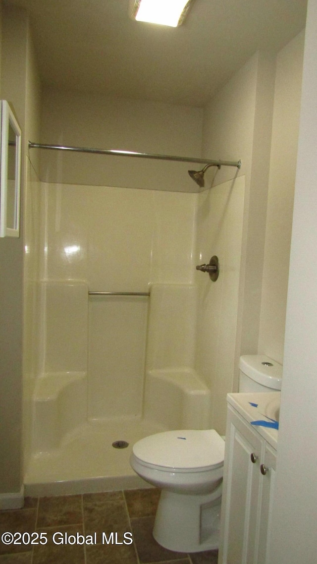 8 Cloverleaf Dr, Warrensburg, NY 12885 - bathroom with vanity, a shower, and toilet