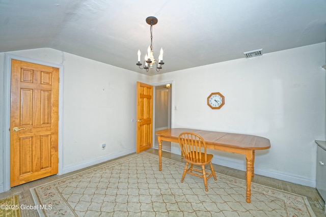 805 Karenwald Ln, Schenectady, NY 12309 - dining room featuring a chandelier and vaulted ceiling