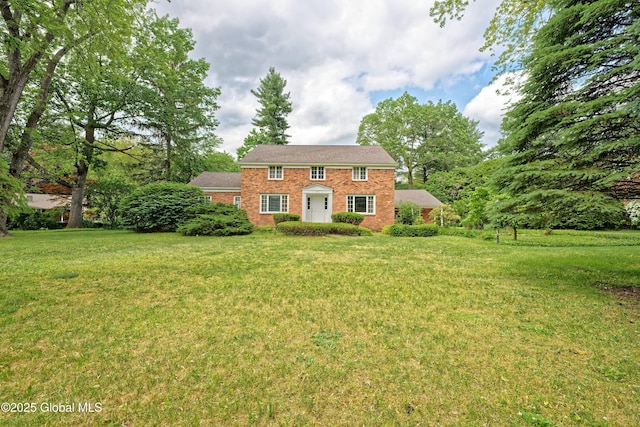 805 Karenwald Ln, Schenectady, NY 12309 - colonial-style house featuring a front lawn and brick siding