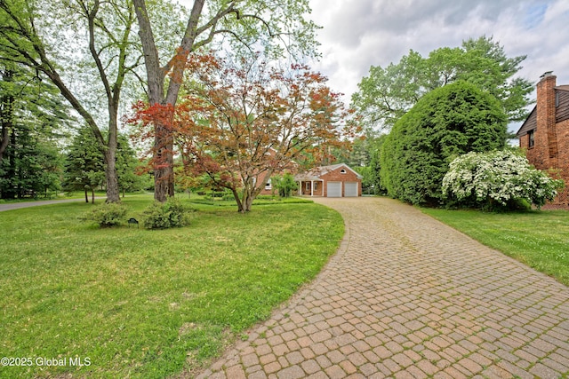 805 Karenwald Ln, Schenectady, NY 12309 - view of front facade with a front lawn, driveway, and an outbuilding