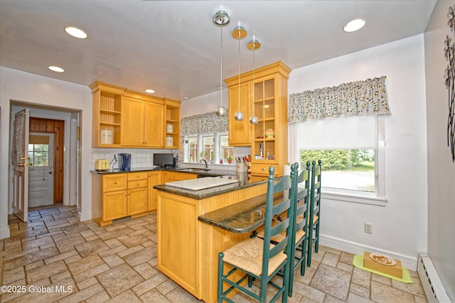 805 Karenwald Ln, Schenectady, NY 12309 - kitchen with open shelves, a baseboard heating unit, stone tile flooring, a peninsula, and plenty of natural light