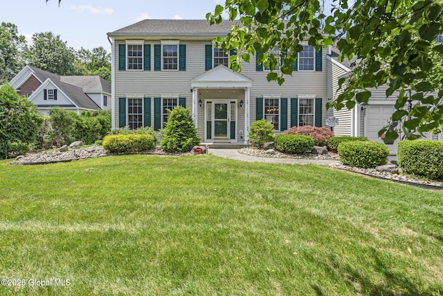 41 Jean Pl, Guilderland, NY 12303 - colonial house featuring a front yard and a garage