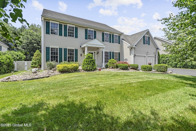 41 Jean Pl, Guilderland, NY 12303 - colonial-style house with a garage and asphalt driveway