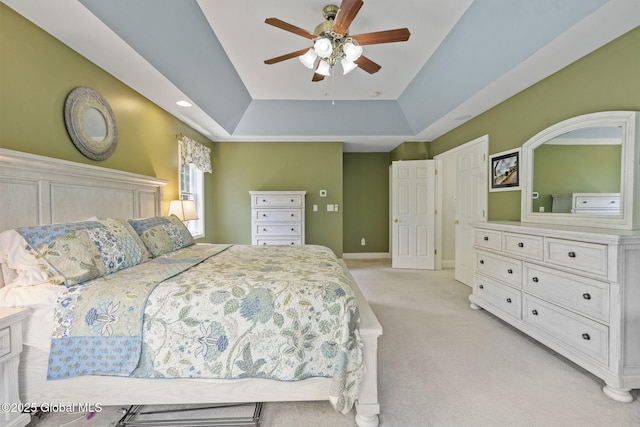 41 Jean Pl, Guilderland, NY 12303 - bedroom featuring a tray ceiling, light colored carpet, and ceiling fan