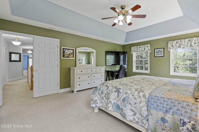 41 Jean Pl, Guilderland, NY 12303 - bedroom with light carpet, a tray ceiling, multiple windows, and ceiling fan