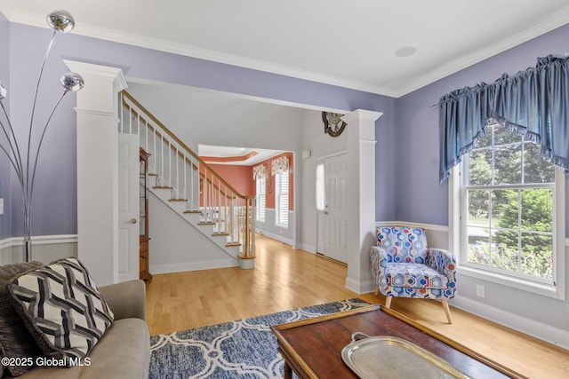 41 Jean Pl, Guilderland, NY 12303 - living area with stairs, wood finished floors, healthy amount of natural light, and ornamental molding