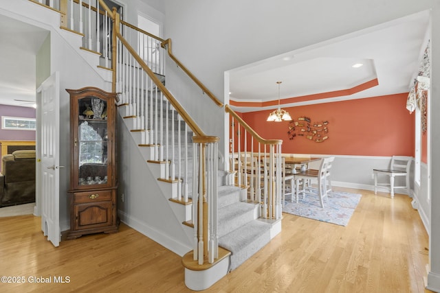 41 Jean Pl, Guilderland, NY 12303 - staircase featuring wood finished floors and a chandelier