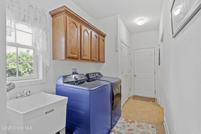 41 Jean Pl, Guilderland, NY 12303 - laundry area featuring washing machine and dryer, cabinet space, and light tile patterned floors
