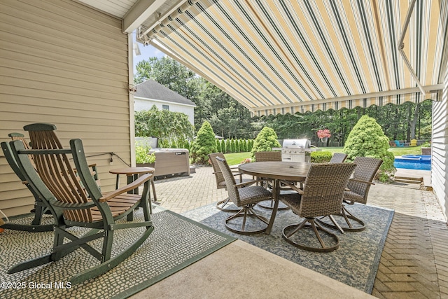 41 Jean Pl, Guilderland, NY 12303 - view of patio with outdoor dining space, grilling area, and a swimming pool