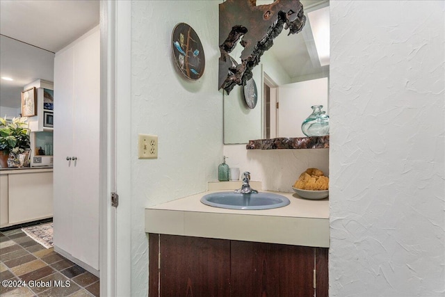 290 Camden Valley Rd, Salem, NY 12873 - bathroom with a textured wall, vanity, and stone finish floors
