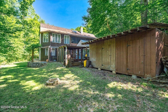 290 Camden Valley Rd, Salem, NY 12873 - back of property featuring a storage shed, a fire pit, and a yard